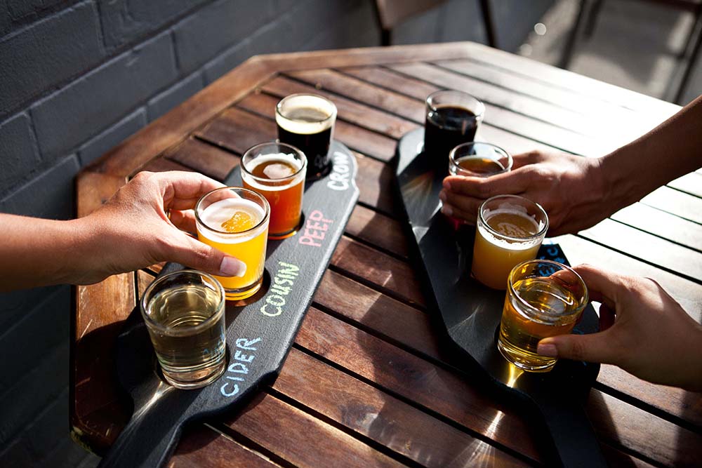 Flight of brews on the patio at Refined Fool Brewing Co. 